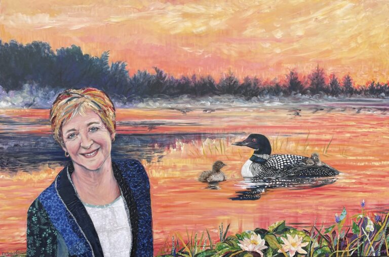 Maude Barlow on a lake at sunrise with a loon